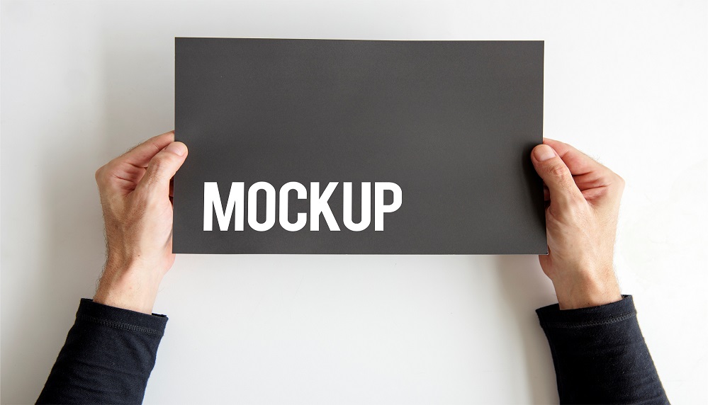Hand Holding Paper Card Mockup PSD Free Download